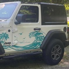 a white jeep parked on top of a grass covered field next to trees and bushes