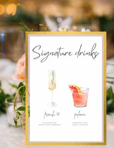 a sign that says signature drinks and two glasses with oranges in them on a table