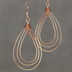 This unique triple hoop earrings are handmade using copper wire. ;-) My contact number: 626-379-1904. Please contact me if you would like to order multiples or customize a design for your special event, I will be pleased to give you a discount on a quantity order. ;-) Purchases will be shipped within 1-3 business days. In case of occasional shortage of beads material, purchases will be shipped in a week. Packages are shipped via USPS first-class mail with delivery confirmation. We will e-mail th Wrapped Hoop Earrings, Guitar Jewelry, Wire Jewelry Earrings, Triple Hoop Earrings, Bijoux Fil Aluminium, Wire Jewelry Tutorial, Wire Jewelry Designs, Earrings Teardrop, Family Jewellery