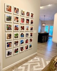 a living room with pictures on the wall