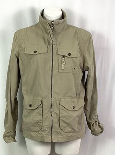 Eddie Bauer ladies-utility/safari jacket Size large Drawstring collar Rolled tab sleeves Four snap pockets-(one with a tiny zipper(see photos, upper left pool n Ruched  on the back at the waist line for some fullness-(adds  a feminine look) Zip front 100% nylon Like new condition Machine wash tag Long Sleeve Utility Jacket With Cargo Pockets For Travel, Long Sleeve Utility Jacket With Multiple Pockets For Travel, Travel Utility Jacket With Multiple Pockets And Long Sleeves, Khaki Utility Jacket For Travel In Spring, Khaki Utility Jacket For Spring Travel, Spring Khaki Utility Jacket For Travel, Spring Travel Utility Jacket In Khaki, Khaki Long Sleeve Utility Jacket For Travel, Khaki Utility Jacket With Pockets For Travel