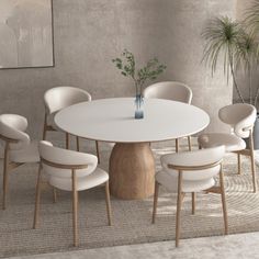 a white table with six chairs around it