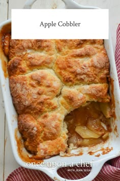 an apple cobbler in a white casserole dish with the title above it