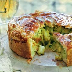 there is a pie that has been cut in half and ready to be eaten on the table