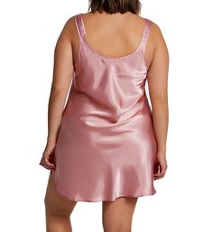 This short gown will be your new bedtime favorite its is flattering bias cut, soft satin fabric, and scoop neckline. Straps do not adjust. Cut on the bias for a beautiful drape. Relaxed styling provides a comfortable fit. Scoop neckline gives you more coverage. Fabric shoulder straps do not adjust. Bottom front of straps has decorative bow. Satin body is silky and lustrous. Lightweight satin is perfect for warm weather sleep and lounge. Made in the USA. Sleeveless. Short length. Pullover styling Fitted Satin Nightgown For Pajama Party, Satin Nightgown With Bias Cut For Sleep, Satin Bias Cut Nightgown For Sleep, Fitted Satin Sleepwear With Bias Cut, Satin Dress For Bedtime, Fitted Bias Cut Satin Sleepwear, Fitted Bias-cut Satin Sleepwear, Solid Color Satin Nightgown For Bedtime, Short Gowns