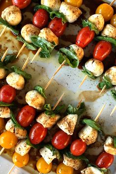 several skewers of food with tomatoes and mozzarella