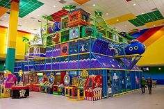 an indoor play area with lots of toys