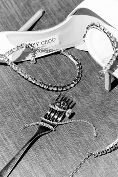 black and white photograph of jewelry on table