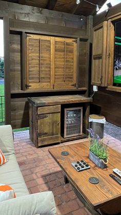 a living room filled with furniture and a flat screen tv mounted to the side of a wall