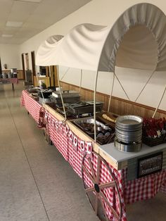 a buffet table with food on it in a room