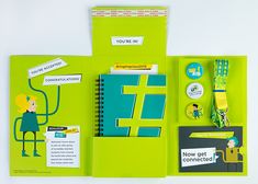 an open notebook with stickers and magnets on it