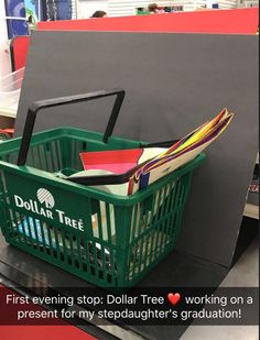 a green shopping basket filled with books and folders