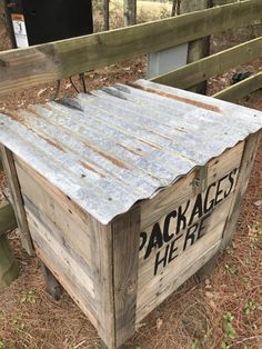 an old wooden crate with the words packages here written on it