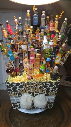 a basket filled with lots of liquor bottles