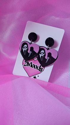 Scream Mask Earrings Spooky Season is here These Scream heart earrings are super Cute! They have glitter throughout the border and a glossy finish! Halloween Party Heart-shaped Earrings, Heart-shaped Halloween Party Earrings, Movie Jewelry, Scream Mask, Halloween Horror Movies, Scream Movie, Pink Halloween, Earrings Pink, Halloween Horror