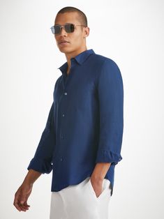 The Monaco shirt features a curved back yoke with a box-pleat for comfort and a curved hem with side vents for ease of movement. We've used the classic styling of a button-through front and cuffs, a 2-piece collar and for a modern addition, we've added a U-shaped breast pocket with a handy sunglass loop for effortless summer chic. For a final touch of luxe, the shirt is finished with mother of pearl buttons throughout and our minimalist rose logo label at the hem. There's also a handy 'locker' l Long Sleeve Shirt With Concealed Placket For Summer, Summer Long Sleeve Shirt With Concealed Placket, Timeless Summer Tops With Spread Collar, Classic Summer Shirt With Fold Down Collar, Classic Shirt With Concealed Placket And Shirttail Hem, Classic Summer Shirt With Concealed Placket, Classic Solid Color Tops With Straight Hem, Formal Summer Shirt With Cuffed Sleeves, Classic Solid Color Top With Straight Hem