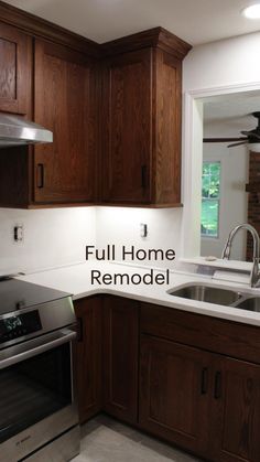 a kitchen with wooden cabinets and stainless steel appliances