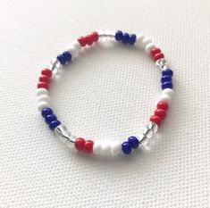 **This listing is for one (1) multi-colored Red, White and Blue bracelet. No two bracelets will look exactly alike, making it totally fun and totally patriotic! Bracelets are made using stretchy elastic to easily and comfortably slip onto your wrist.  **Please note if you select the “With Name” Affordable Red Beaded Bracelet For 4th Of July, Patriotic White Stretch Bracelet With Round Beads, Patriotic White Stretch Bracelet, Adjustable White Bracelet For 4th Of July, 4th Of July Bracelets, White And Blue Bracelet, Kids 4th Of July, Patriotic Bracelet, 4th Of July Shirts