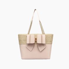 Best of both words, this bow dual vegan leather tote bag is your next go-to beach or picnic bag. Adorned with a chic bowtie ornament and spacious interior for storing all your essentials for a full Summer day. 100% Vegan Leather 16"W * 11 1/2"H * 6"D 11" Dual chain link top handle Zipper closure 37.53 oz Style# T9CX09 Elegant Bags With Bow For Everyday Use, Chic Bags With Detachable Bow For Everyday Use, Chic Everyday Bags With Bow Detail, Chic Everyday Bags With Bow, Chic Rectangular Bag With Detachable Bow, Elegant Tote Shoulder Bag With Bow, Elegant Bow Tote Shoulder Bag, Daily Use Tote Bag With Bow, Chic Shoulder Bag With Detachable Bow