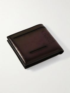 Berluti's 'Makore Neo Taglio' wallet is crafted from smooth Venezia leather that will develop its own unique patina over time. It's engraved with the signature 'Scritto' motif and has eight slots for your most-used cards. Luxury Leather-lined Trifold Wallet For Formal Occasions, Luxury Leather Trifold Wallet For Formal Occasions, Luxury Leather Trifold Wallet For Evening, Designer Leather Trifold Wallet, Luxury Leather Trifold Wallet, Designer Trifold Leather Wallet With Coin Pocket, Designer Trifold Wallet For Formal Occasions, Luxury Trifold Wallet For Formal Occasion, Designer Leather Bifold Wallet