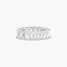 an emerald cut diamond ring on a white background