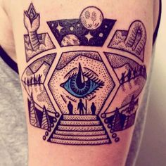 a tattoo with an all seeing eye on it