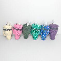 small crocheted items are lined up in a row