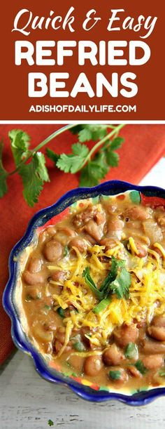 a bowl filled with beans, cheese and cilantro