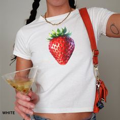 🍓 Add a splash of sweetness to your wardrobe with this Juicy Strawberry Graphic T-Shirt! Perfectly tailored for those who love a touch of retro and coquette vibes. Crafted with high-quality material, this tee ensures comfort and durability while keeping you stylish. Ideal for summer outings or cozy indoor gatherings, it's a must-have for any fashion-forward wardrobe. 🎀💕  Looking for a graphic baby tee nostalgic of the 90s? Bring your Y2K outfit dreams to life with our newest collection. This Retro Strawberry Print Summer Tops, Retro Strawberry Print Tops For Summer, Trendy Fitted Fruit Print Top, Fitted Summer T-shirt With Strawberry Print, Fitted Strawberry Print T-shirt For Summer, Summer Y2k T-shirt With Fruit Print, Strawberry Graphic, Coquette Vibes, Graphic Baby Tee