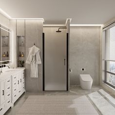 a bathroom with a walk in shower next to a white toilet and sink under a window