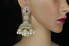 About the Jewellery   Royal jhumkas look as ravishing as this pair resplendent with ruby,Emrald and American diamonds. Wear this and be sure to be a head turner on any occasion.  Details & Specifications Metal-Brass, silver Finish-Diamond Polish-24ct gold Stones-Ad Size-Big Earrings-push,clip system For-Woman Occasion-Birthday, party, wedding, Reception, engejment Diamond Jhumkas, Party Wedding Reception, Tea Wedding Favors, Mehndi Decor, Diamond Choker Necklace, Diamond Choker, Choker Necklace Set, Big Earrings, American Diamond