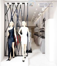 two mannequins dressed in black and white are standing next to each other