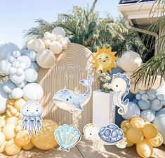 an ocean themed birthday party with balloons and decorations