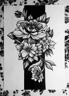 a black and white drawing of flowers on paper