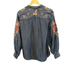 Chico's Women's Floral Embroidered Applique Bohemian Pin Tucked Blouse Size 6  Indulge in the artistry of Chico's with this embroidered floral denim blouse. The intricate floral patterns enhance its elegance and charm, offering a sophisticated yet casual look. * Buttoned cuffs  * Lightweight fabric  * Machine washable  Style: Floral, Embroidered, Applique, Bohemian, Pin Tucked Content: Lenzing Washing Instructions: Machine Wash Measurements: Armpit to armpit: 20" Back of Collar to Bottom Hem: 27" We ship most items out the next business day. Please contact us with any additional questions. We are happy to combine shipping when possible. Thank you! Features: * Floral, Embroidered, Applique, Bohemian, Pin Tucked Size: Womens 6 Condition: Pre-Owned Good Folk Style Blouse With Tonal Embroidery For Spring, Bohemian Cotton Blouse With Tonal Embroidery, Traditional Long Sleeve Tops With Tonal Embroidery, Bohemian Spring Tops With Tonal Embroidery, Spring Bohemian Tops With Tonal Embroidery, Bohemian Tops With Tonal Embroidery For Spring, Long Sleeve Peasant Top With Intricate Embroidery For Fall, Bohemian Long Sleeve Blouse With Floral Embroidery, Bohemian Embroidered Top With Tonal Embroidery For Fall