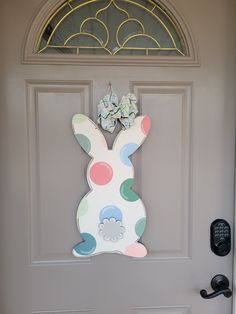 an easter bunny door hanger on a front door