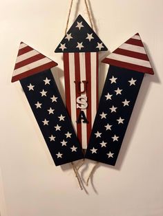 an american flag kite hanging on a wall