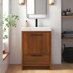 a bathroom with a sink, mirror and shelving unit in the corner next to it