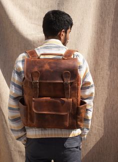 Leather Backpack, Handmade Leather Rucksack, Personalised Leather Laptop Backpack, Leather Trekking Backpack, Leather Hiking Bag Men Women Dimensions: 12 X 16 X 5 Inches The Leather Backpack is beautifully crafted while ensuring the durability and utility respective to all kinds of outdoor activities. The product is made by using 100 % Buffalo Full Grain leather with Polyester lining. We have used premium quality Waxed Buffalo leather. The Backpack contains 2 spacious compartments for books, fil Classic Outdoor Backpack With Leather Backing, Vintage Leather Travel Backpack, Leather Outdoor Backpack, Classic Leather Backpack With Leather Backing For Outdoor, Leather Backed Backpack For Everyday Use, Outdoor Leather Backpack With Leather Lining, Classic Outdoor Leather Backpack, Leather Adventure Backpack, Brown Large Capacity Leather Backpack For Adventure