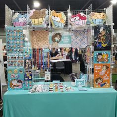 a table with many items on it at a convention