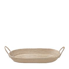 an oval woven tray with handles on the bottom and sides, made from natural materials