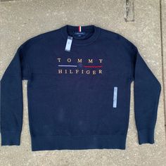 Brand New Perfect Condition Never Worn With Tags Msrp $119 Long Lasting Durable Material This Sweatshirt Has A Gorgeous Tommy Hilfiger Emblem On The Chest And Makes A Perfect Shirt For Any Casual Or Business Attire Outfit. Thick Durable Material And Long Sleeves To Keep You Warm Follow Me For More Discounted Items! Blue Fall Streetwear Sweater, Blue Relaxed Fit Top With Ribbed Collar, Blue Tops With Ribbed Collar And Relaxed Fit, Navy Winter Top With Ribbed Collar, Blue Crew Neck Top For Fall, Blue Top With Ribbed Collar For Winter, Navy Letter Print Sweater For Winter, Casual Blue Sweater With Ribbed Collar, Casual Blue Tops With Ribbed Cuffs