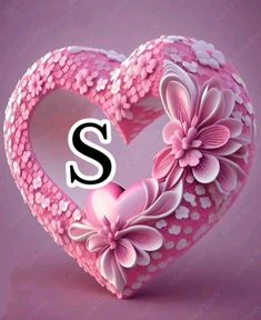 a pink heart with flowers and the letter s on it