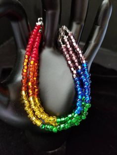 This bracelet features 6 inches of rainbow spectrum seed beads. With clasp and chain this bracelet is adjustable between 7 inches and 9 inches. Rainbow Spectrum, Seed Bead Bracelet, Seed Bead Bracelets, Bead Bracelet, Seed Bead, 6 Inches, Seed Beads, Swirl, Jewelry Bracelets