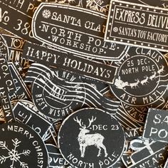 many black and white christmas stickers on top of each other