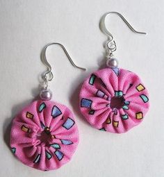 pair of pink fabric earrings with silver earwires