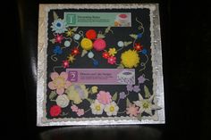 a sheet cake with flowers and buttons on it