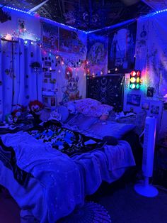 a bedroom with blue lights and decorations on the walls