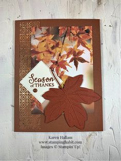 a close up of a card with leaves on it