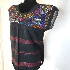 High quality Handmade beautiful Mexican blouse, beautiful and unique Pieces made by Mexicans artisans -Made: cotton fabric -handmade -traditional floral embroidery - message me for any questions Medium: 19in across shoulders, 19.5in across chest and 25in long Large: 21 in across shoulders, 20in across chest and 30in long Visit us at Omxboutique.com Mexican Embroidered Shirt, Embroidery Message, Mexican Shoes, Mexican Blouse, Half Moon Bay, Shoes Photo, Traditional Mexican, Leather Coin Purse, Shirt Embroidery